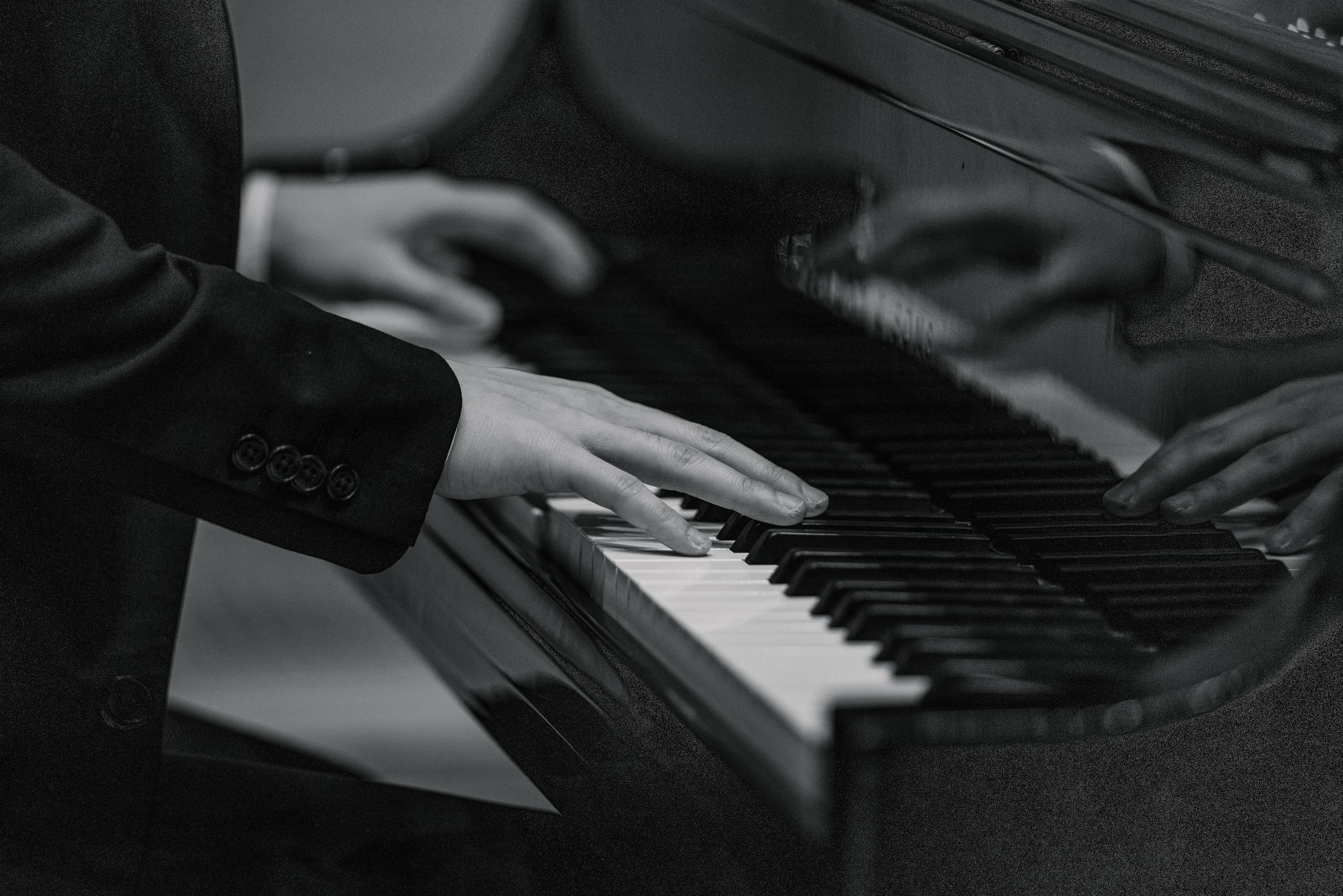 Hands playing piano